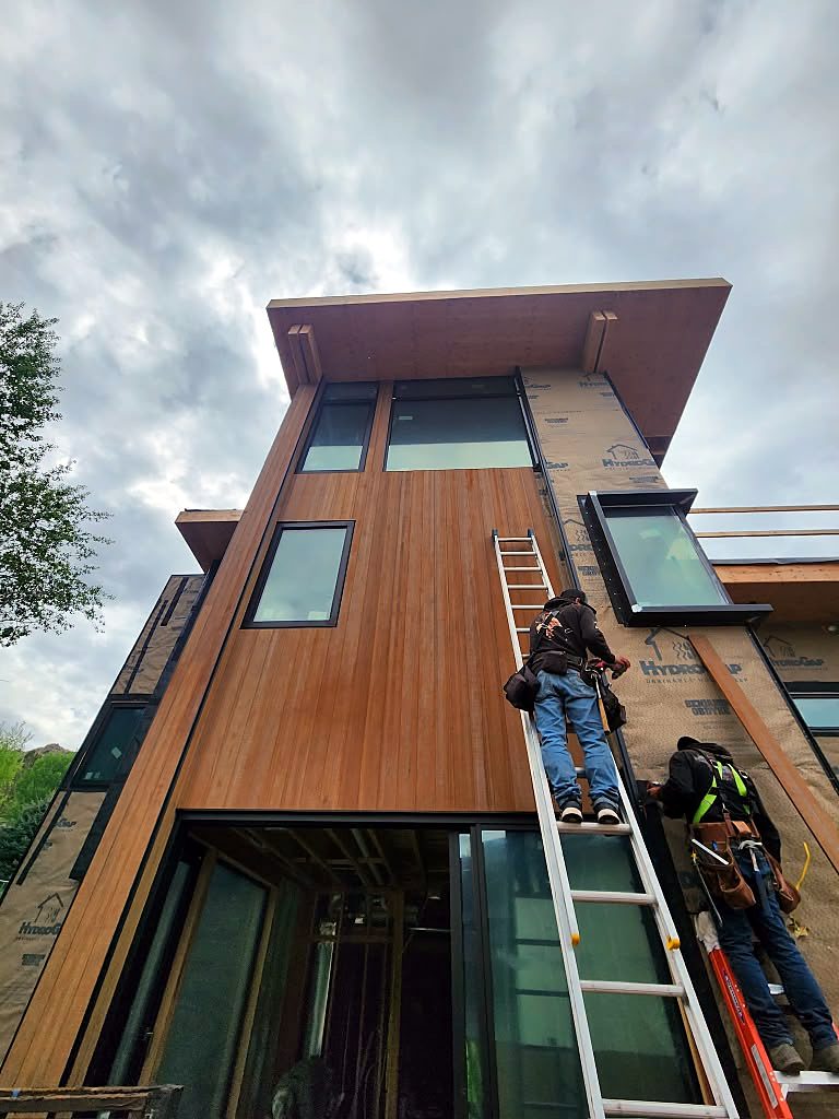 Crew installing siding